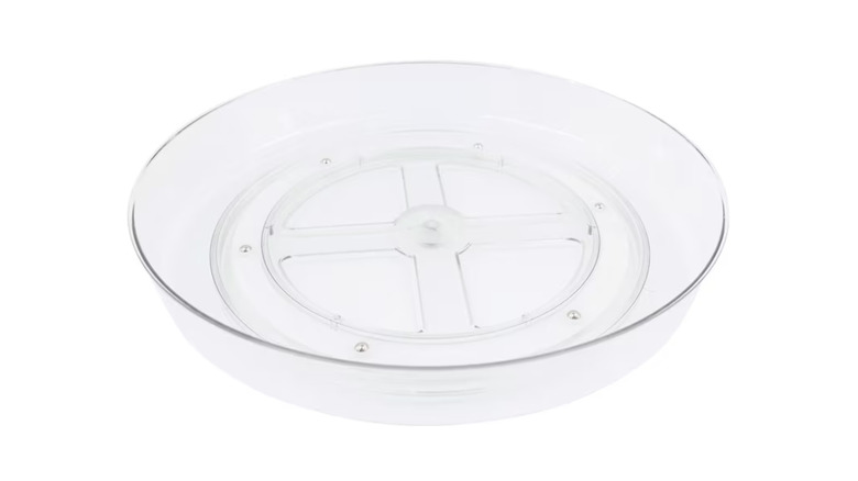 A clear rotating kitchen turntable.