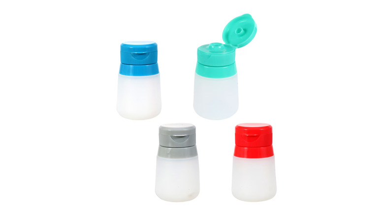 Four silicone salad dressing container in different colors