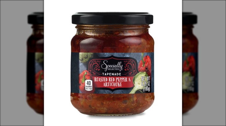 jar of roasted red pepper and artichoke tapenade