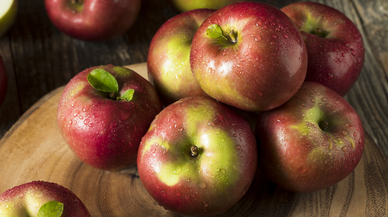 Stack of McIntosh apples on board