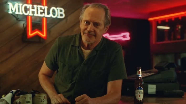 Steve Buscemi leaning on bar