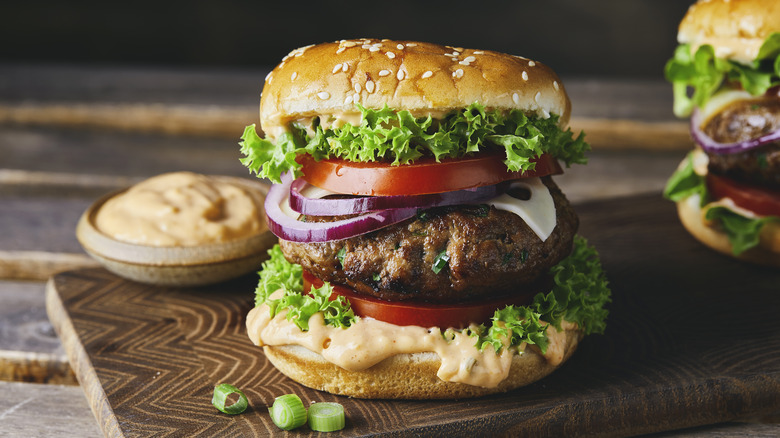 Burgers on wooden board