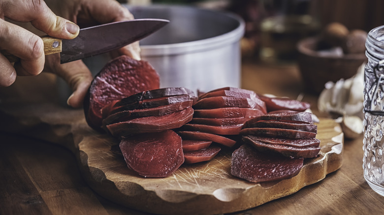 Slicing beets on tray