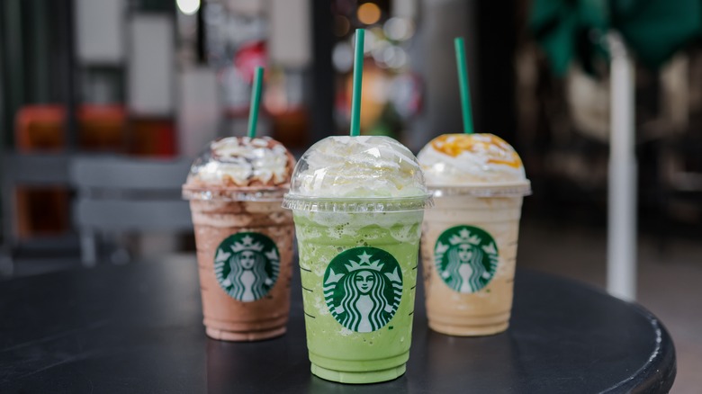 three Starbucks Frappuccinos on table