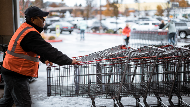 Costco worker pushing carts