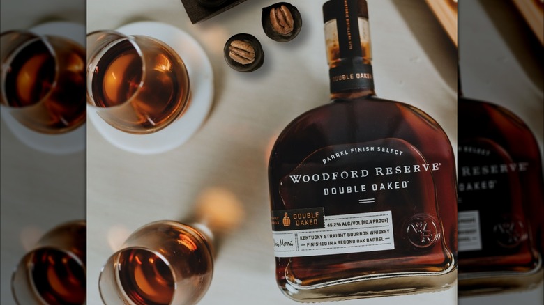 Bottle of Woodford Reserve Double Oaked on a table with two glasses