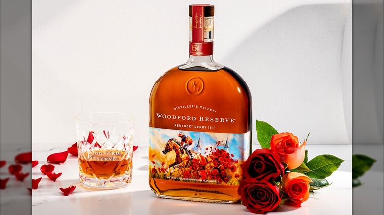 Woodford Reserve's Kentucky Derby bottle on white table with roses