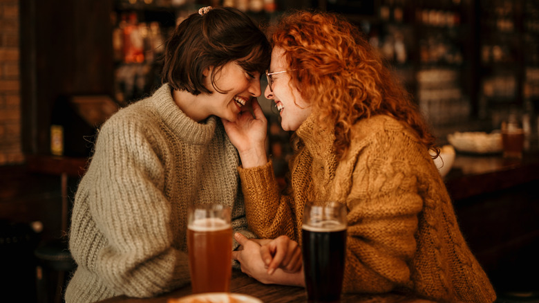 A couple at a bar 