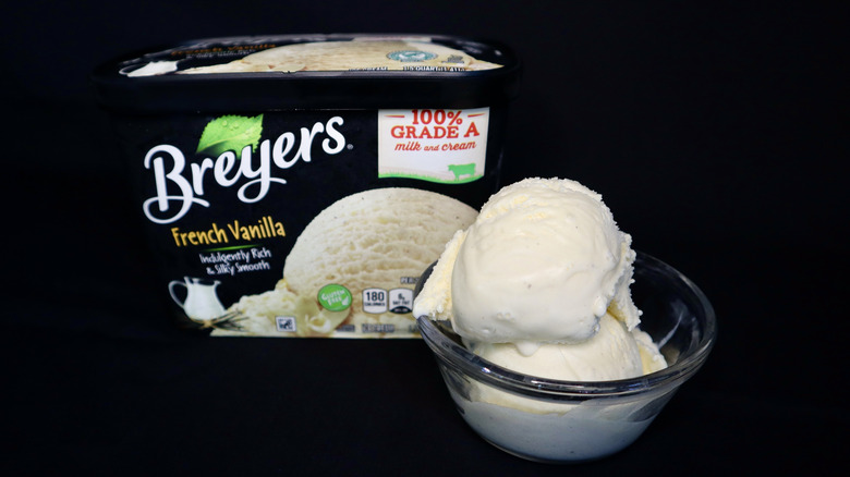 ice cream in bowl in front of black Breyers container