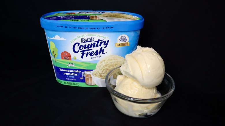 ice cream in bowl in front of blue Dean's container