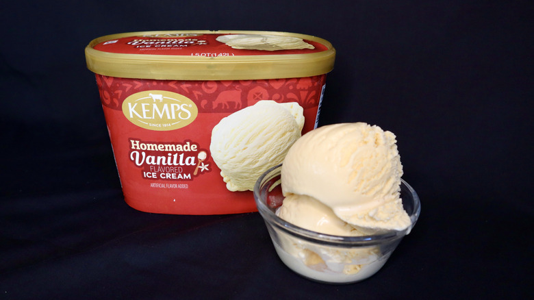 ice cream in bowl in front of red Kemps container