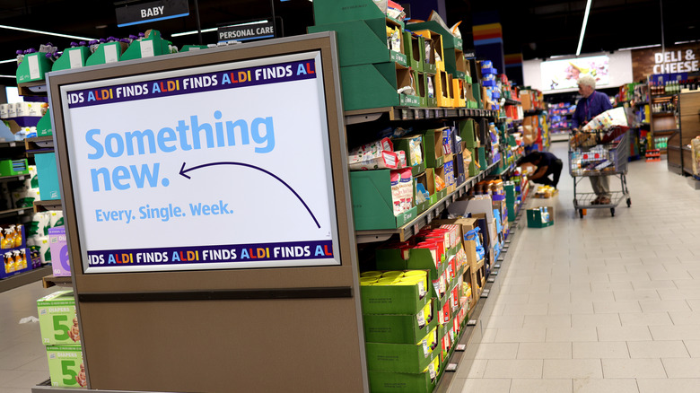 Interior of Aldi aisle with a "Something New" sign