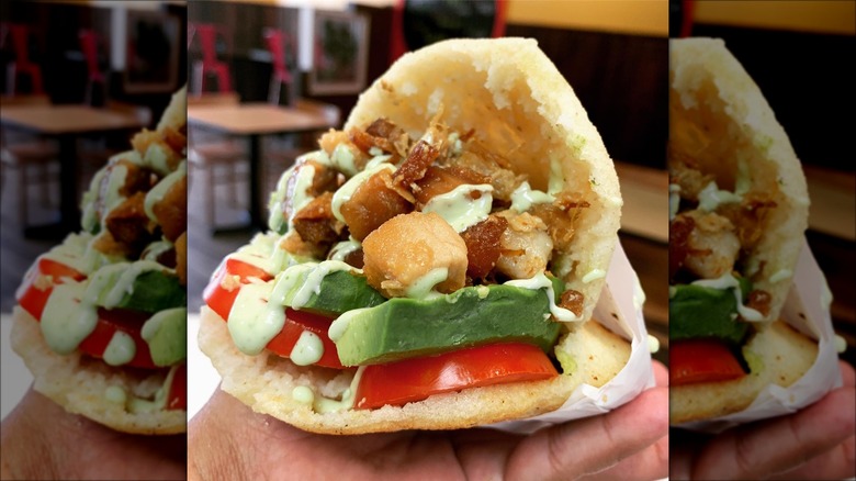 meat and veggie stuffed arepa