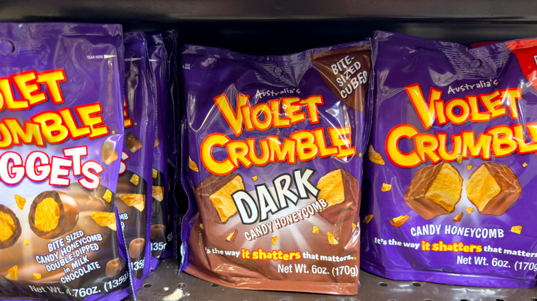 bags of mini Violet Crumble packages on a store shelf