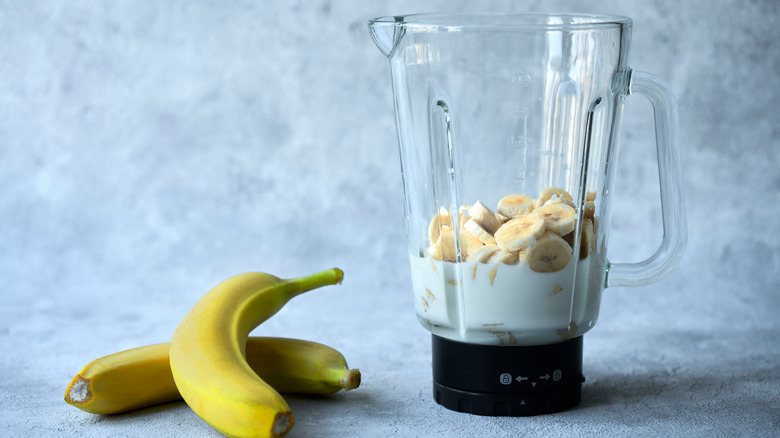 Blender with milk and bananas