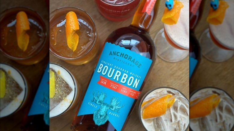 Anchorage Distillery bourbon surrounded by cocktails