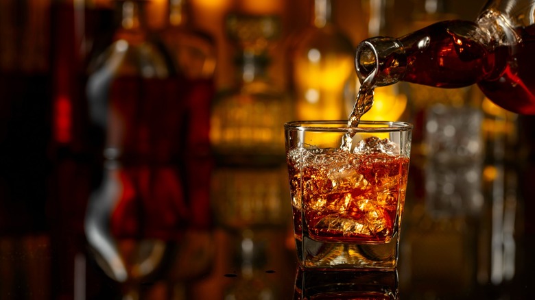 bourbon being poured into a glass