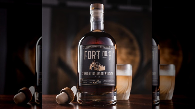Fort Number One Straight Bourbon bottle in front of glass of bourbon