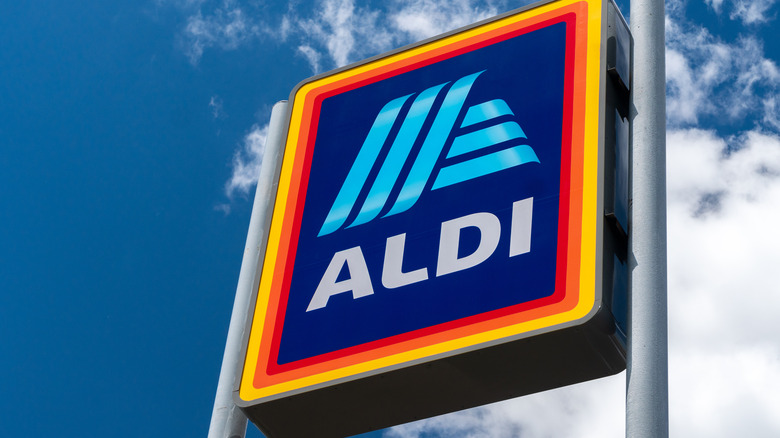 Aldi sign against blue sky