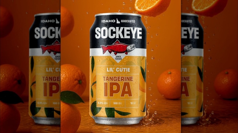 A can of beer with a black, white, and orange design