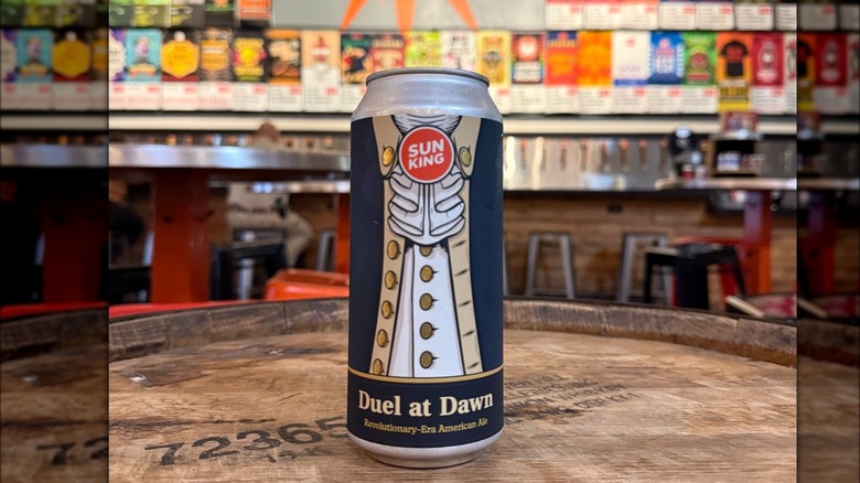 Sun King Duel at Dawn Revolutionary-Era American Ale can of beer on a table