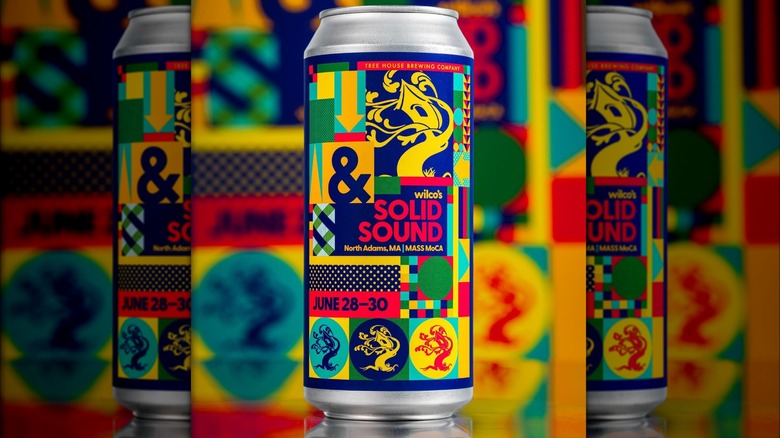 A can of Tree house Brewing Company's wilco's Solid Sound beer.  The design features colorful geometrical shapes in light blue, green, deep blue, red, and yellow. Both in the middle and at the botto of the can there's a logo of a tree with a treehouse.