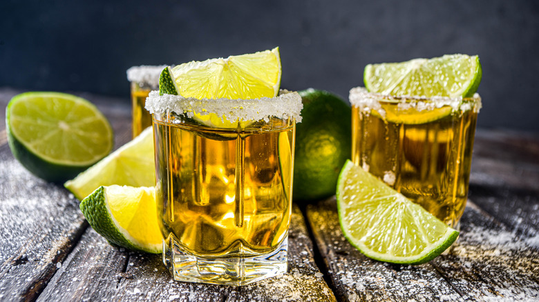 gold tequila shots with limes