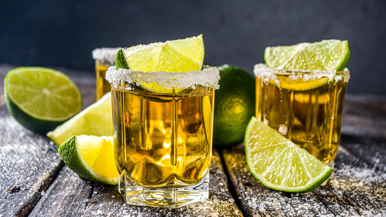 gold tequila shots with limes