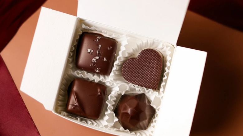 Four-piece box of gourmet chocolates.