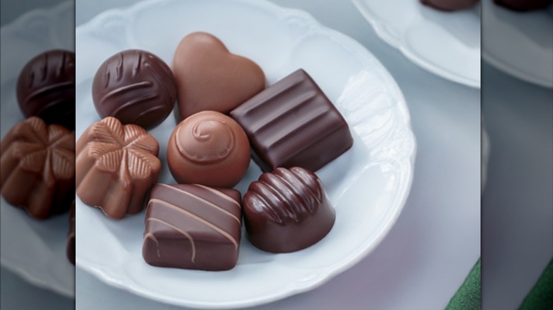 Dish of decorative chocolate candies.