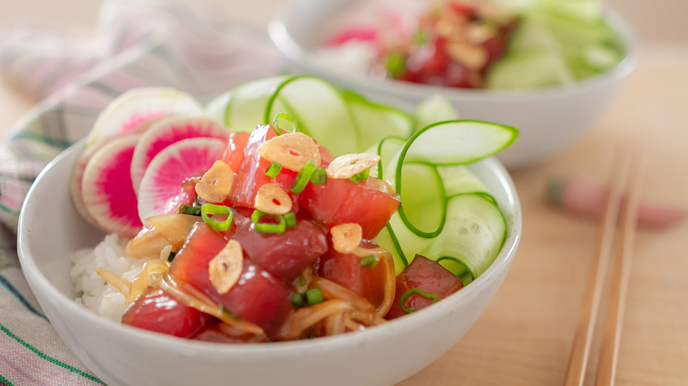 colorful poke bowl in white ceramic bowl