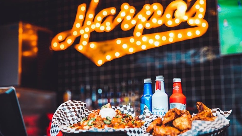 Harpo's Columbia Missouri Skyy Bar nachos, wings, and bottled beer