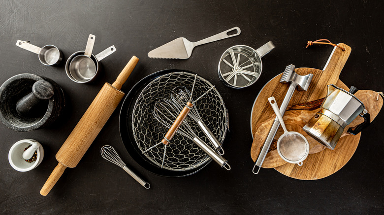 Cooking utensils on black background