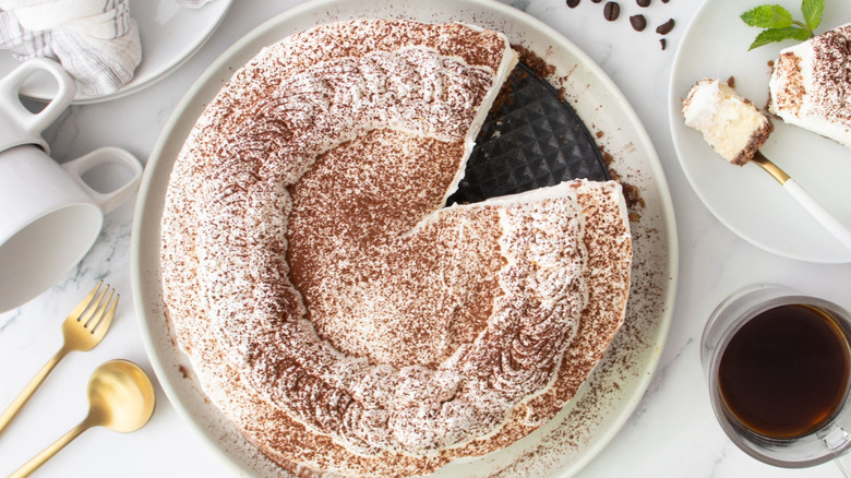 Tiramisu cheesecake with slice removed