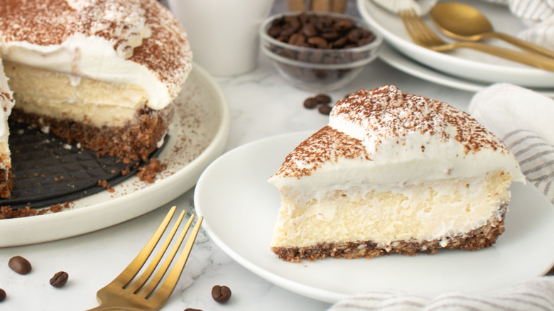 Tiramisu cheesecake slice on plate