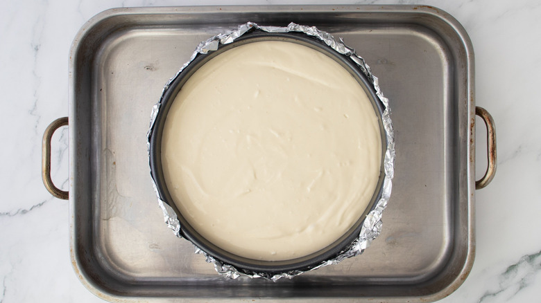 Unbaked cheesecake in pan