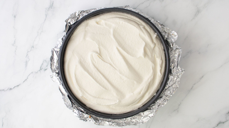 Cheesecake with whipped topping in springform pan