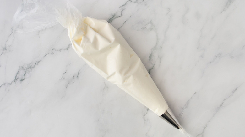 Whipped cream in piping bag