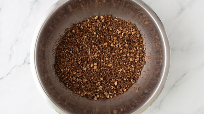 Cheesecake crust ingredients mixed in bowl