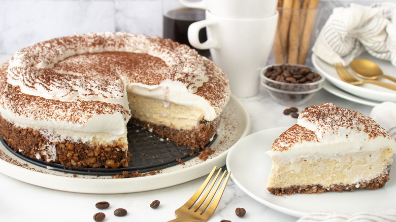 Tiramisu cheesecake next to slice on plate