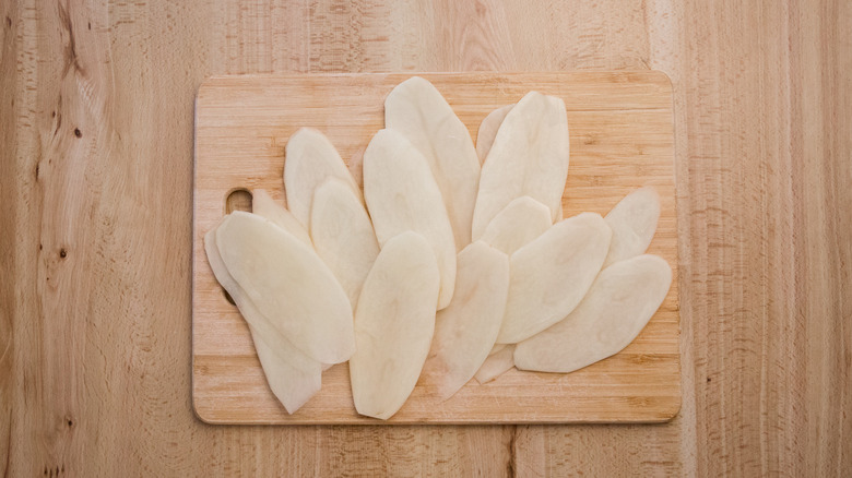 potato slabs on wooden board