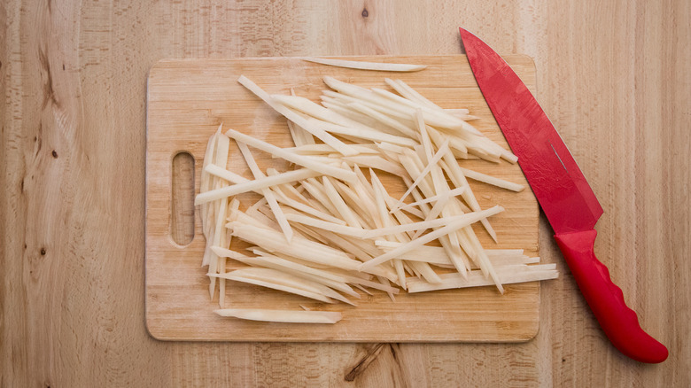 shoestring fries on wooden board