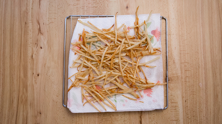 fries draining on paper towels