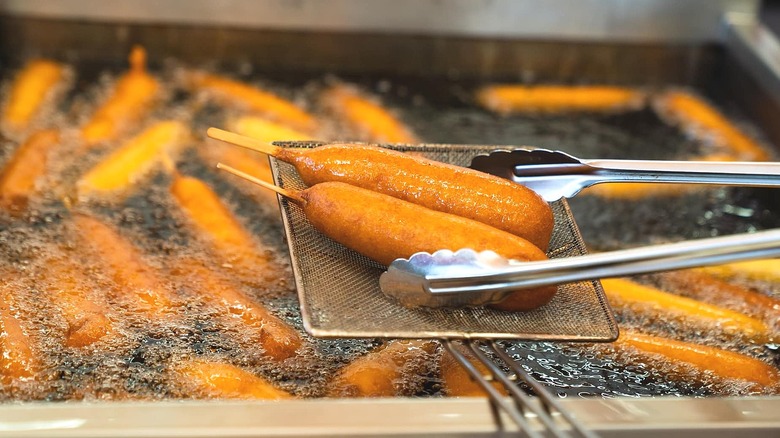 Corn dogs in deep fryer