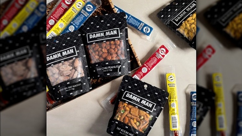 Damn, Man gift box with an assortment of nuts and other snacks, plus beef jerky varieties.