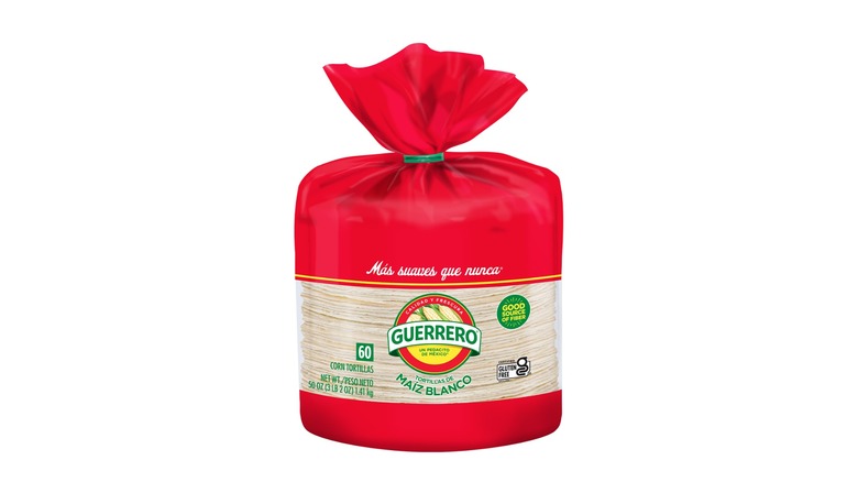 A red package of Guerrero brand corn tortillas on a white background