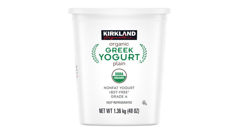 A container of Kirkland Organic Greek Yogurt on a white background