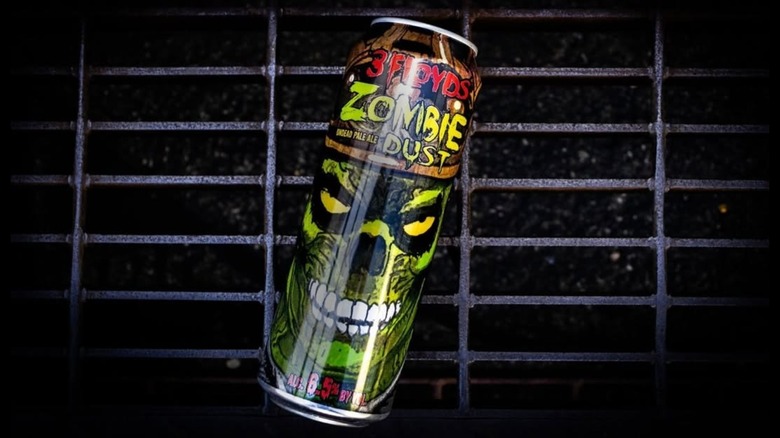 A can of 3 Floyds Zombie Dust, decorated with neon-green zombie art.