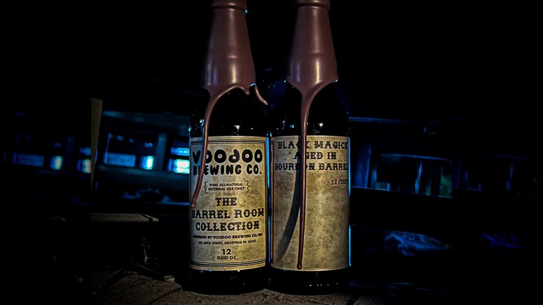 Two wax-dipped bottles of Black Magick from Voodoo Brewing's Barrel Room Collection standing side by side