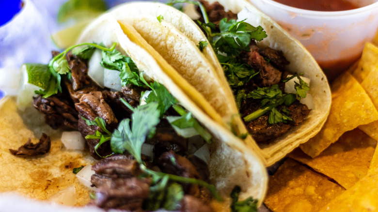 Two carne asada tacos on plate